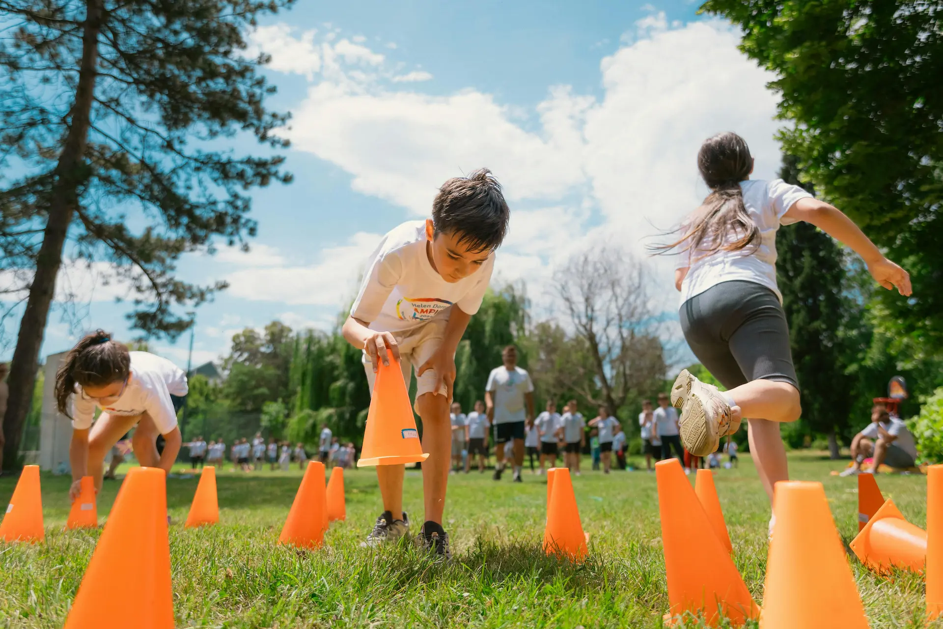 children setting up cones for a pe lesson