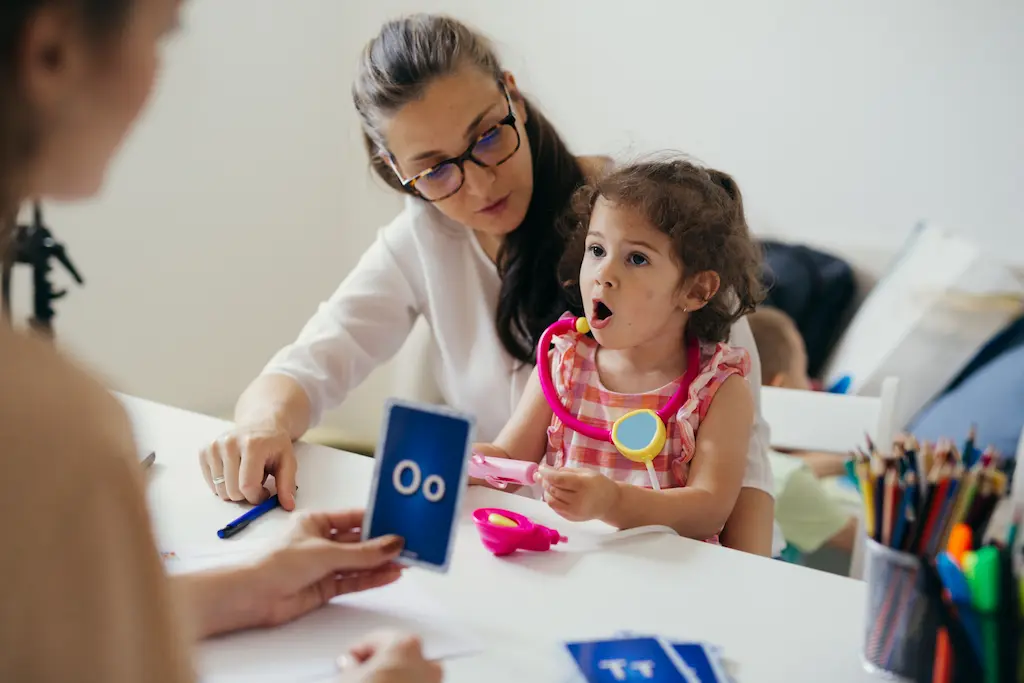 a teacher working directly with a young child